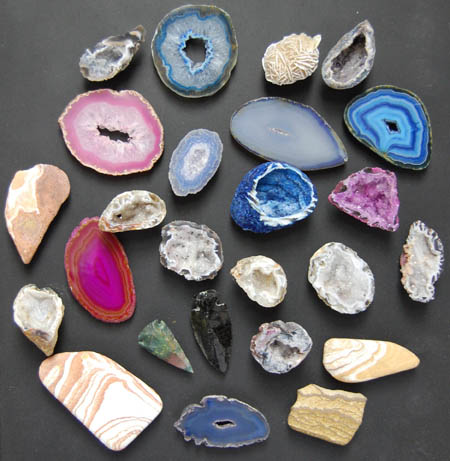 Image of assorted mineral magnets, agate slices, geodes, sandstone, desert roses
