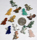 Image of gemstone pendants shaped as a t-rex