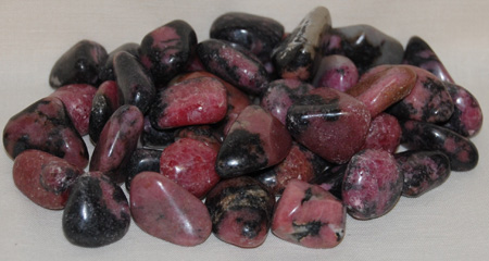 Image of tumbled rhodonite, A quality